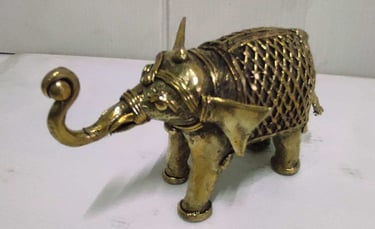 "Small brass elephant with raised trunk and intricate tribal design carvings-For international dispatch"
