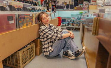 Senior pictures in a record store by Lititz PA senior picture photographer. Senior Rep Team Lancaster PA