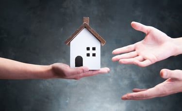 Someone Offering Home to Two Outstretched Hands