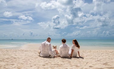 Family sitting together on Khem Beach in Phu Quoc
