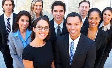 a group of business people standing in front of a building
