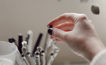a person holding a small glass of water