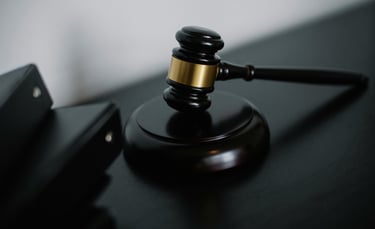 a gavel on a desk showing gold ira regulations and compliance