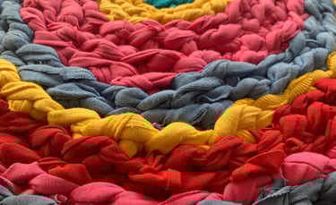handmade multi-coloured crochet rug