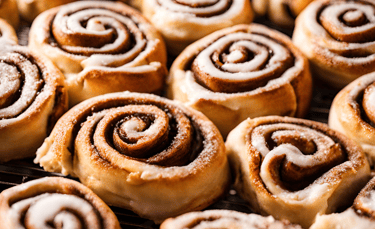 a bunch of cinnamon rolls on a baking sheet