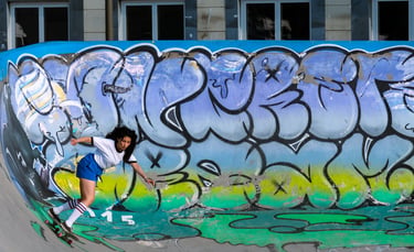 a skateboarder is riding her skateboard on a ramp