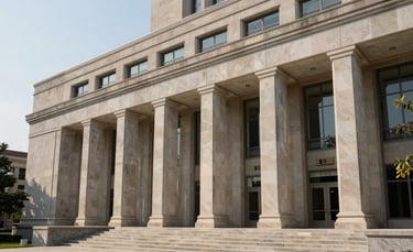 Architectural shot of a modern courthouse or university building in the US, featuring clean lines, stone facades, and large windows, symbolizing institutional strength.
