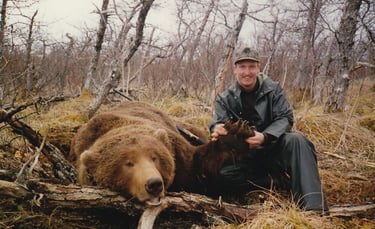 Heritage photo of a trophy grizzly bear harvest, showcasing long-standing guiding experience.