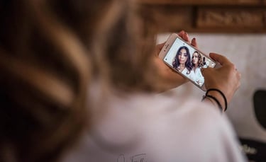 bride and bridesmaid taking a selfie