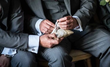 best man trying to find the wedding rings at the ceremony