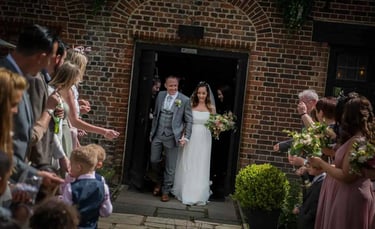 newly-weds stepping outside for their confetti shot