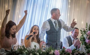 bride and groom giving a speech on their wedding day