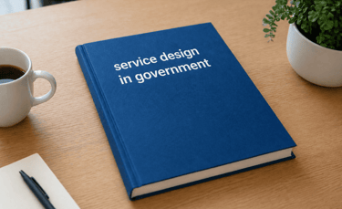 Blue book titled service design in government on wooden table