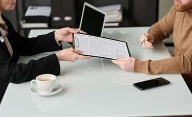 Two people sit at a table