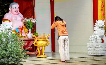 Woman making incense offering at q pagoda, Soc Trang, Vietnam