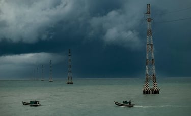 Electricity pylons crossing the ocean. Hon Son, Vietnam