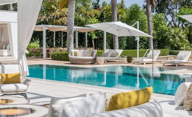 Luxury pool terrace with shaded lounges at Villa Serenity