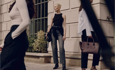 Model wearing a Ninety Percent ribbed knit styled with tailored trousers