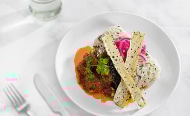 a plate of food with a fork and knife on a table