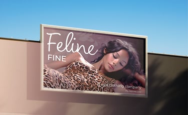 Feline Fine clothing brand billboard featuring bold typography and striking cat-themed design.