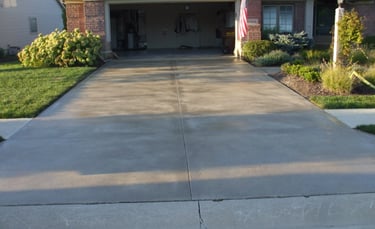 a driveway with a driveway and driveway with a flag
