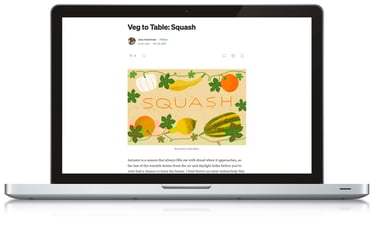 A blog post about seasonal eating in October is shown on a laptop screen.