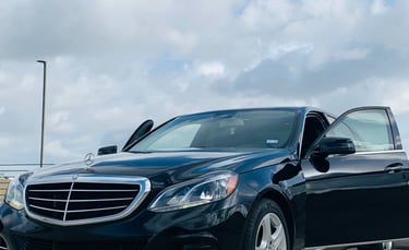 Black Mercedes benz in parking lot