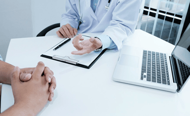 a doctor and patient in a hospital room