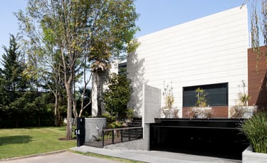 a building with a large white building with a black door