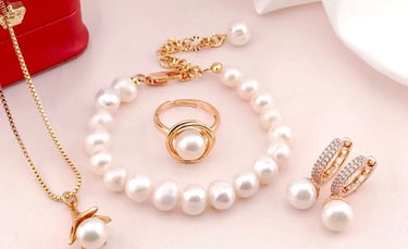 a jewelry set with pearls and a necklace