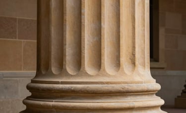 An artistic shot of a courthouse column in Oceania / Australian sandstone, symbolizing stability, history, and the strength of the legal system.