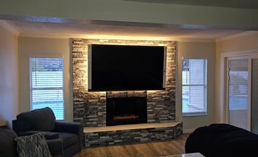 a living room with a television and a couch