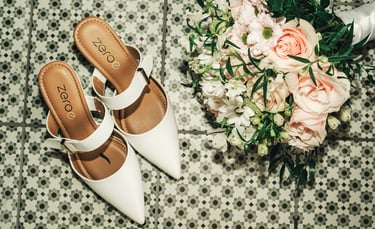 Wedding details flat lay shoes and bouquet elegant styling