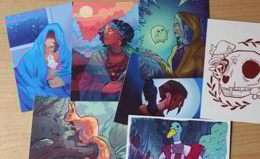 Collection of colorful fantasy art prints featuring characters, animals, and nature themes.