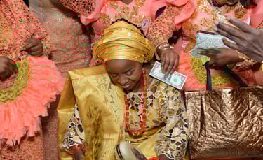 a woman in a gold dress and a gold purse