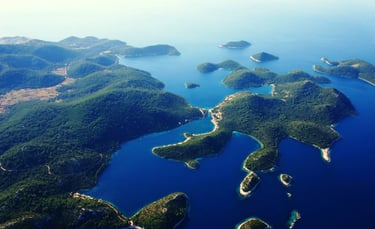 View of Lastovo Archipelago islands with clear blue sea and rocky coastline.