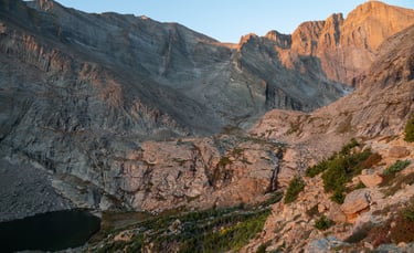 Sunrise alpenglow on the Majestic Longs Peak diamond face, towering above Columbine Falls 