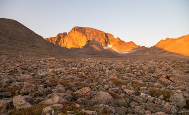  foot Longs Peak glows at sunrise above the 12,600 foot boulderfields