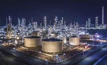 a large industrial oil refinery with a lot of tanks