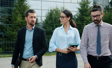 Corporate professionals discussing business expansion and sales execution strategies outdoors