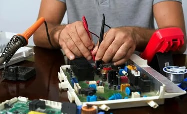Technician assembling custom electronics and OEM circuit board components