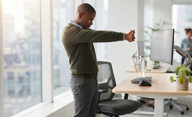 Remote worker performing upper back stretch during a work break