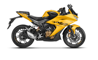 a yellow motorcycle parked on a black background