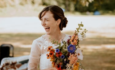 Surrey wedding photography at peace arch with bride holding flowers