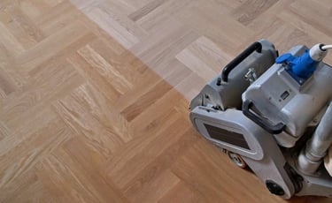Sanding hardwood floors with belt sander