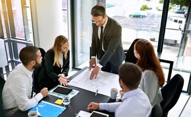 a group of business people working on a project