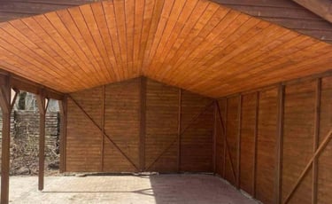 a wooden structure with a wooden roof and a wooden roof