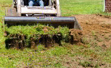 skid-steer-bucket-hauling-dirt.png