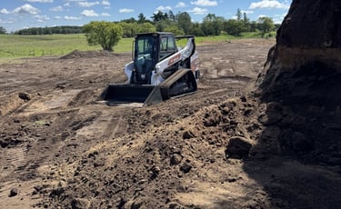 skid steer moving dirt
