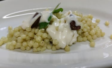 Fregula with pecorino cream, traditional Sardinian dish